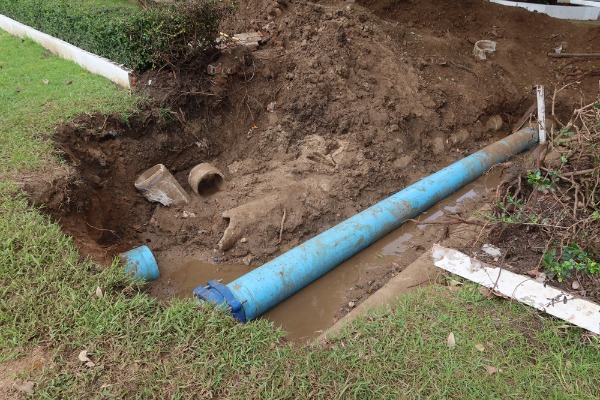 exposed underground water pipe