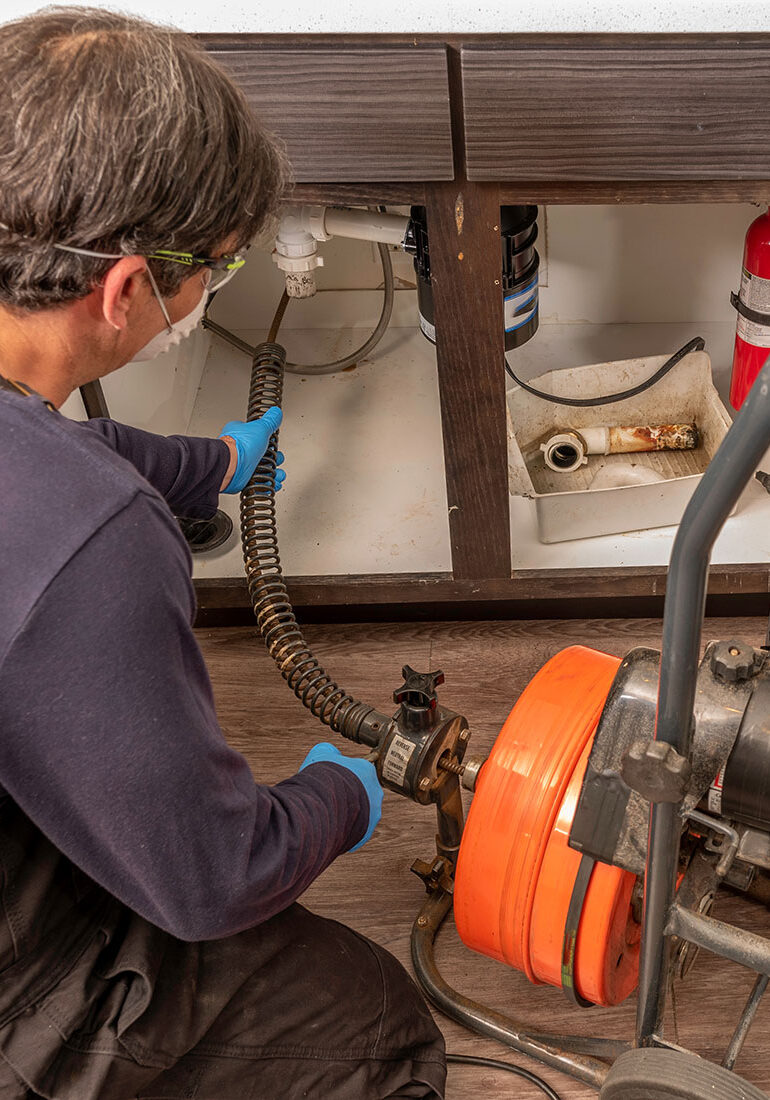 plumber-using-auger